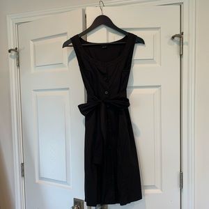 Sleeveless knee length button down dress
